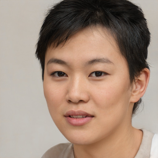 Joyful asian young-adult female with medium  brown hair and brown eyes