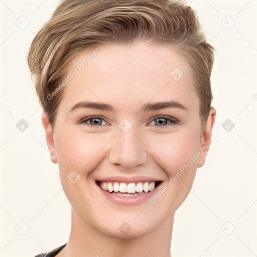 Joyful white young-adult female with short  brown hair and grey eyes