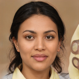 Joyful latino young-adult female with medium  brown hair and brown eyes