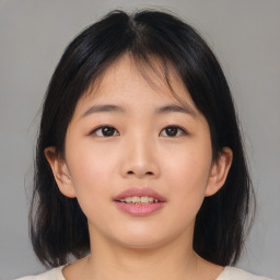 Neutral asian young-adult female with medium  brown hair and brown eyes