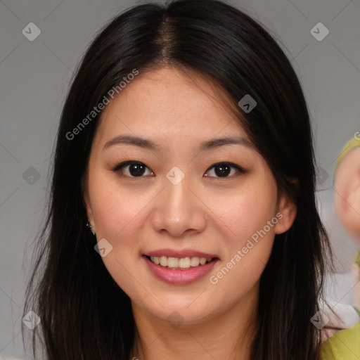 Joyful asian young-adult female with long  brown hair and brown eyes