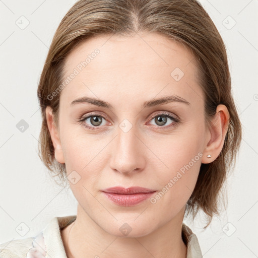 Joyful white young-adult female with medium  brown hair and blue eyes