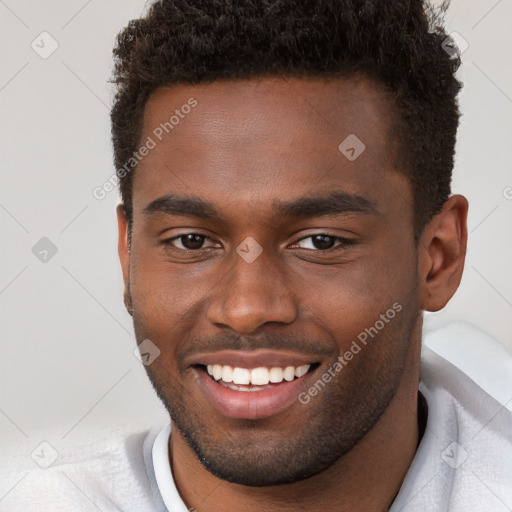 Joyful black young-adult male with short  brown hair and brown eyes