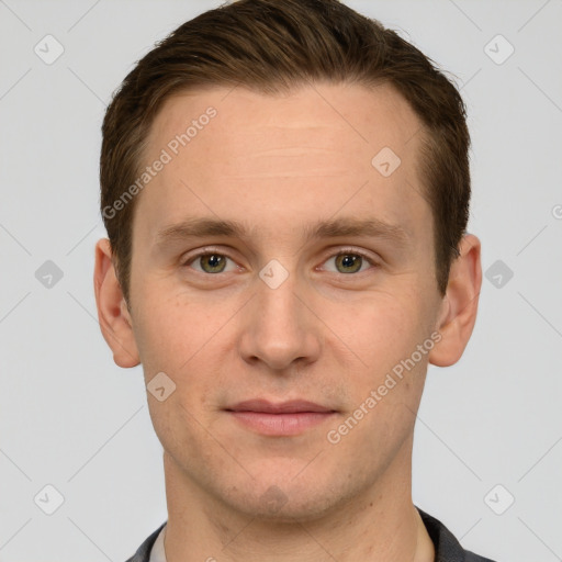 Joyful white young-adult male with short  brown hair and grey eyes