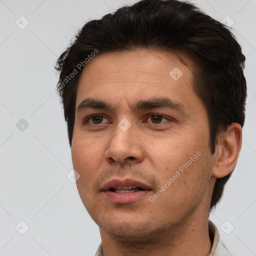 Joyful white adult male with short  brown hair and brown eyes