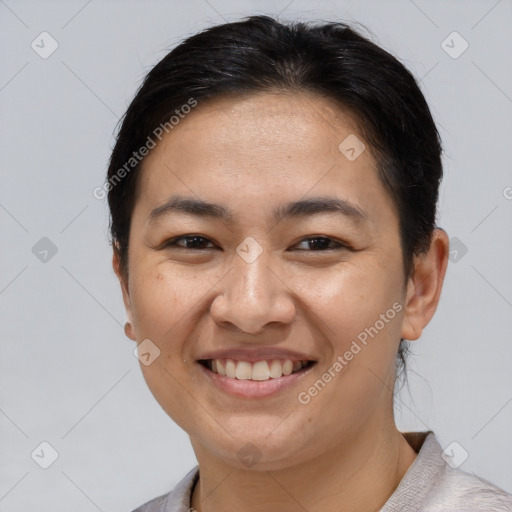 Joyful white young-adult female with short  brown hair and brown eyes