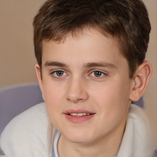 Joyful white child male with short  brown hair and brown eyes