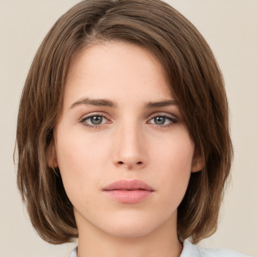 Neutral white young-adult female with medium  brown hair and green eyes