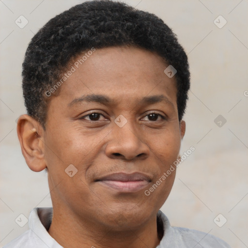 Joyful latino young-adult male with short  brown hair and brown eyes