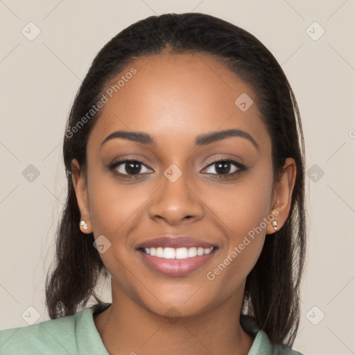 Joyful latino young-adult female with long  black hair and brown eyes