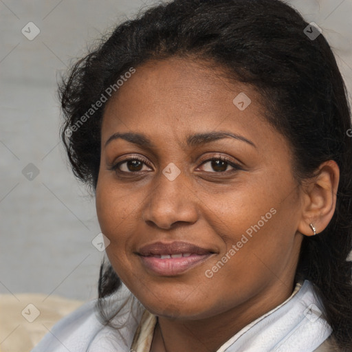 Joyful black adult female with medium  brown hair and brown eyes