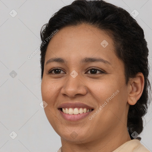 Joyful latino young-adult female with medium  brown hair and brown eyes