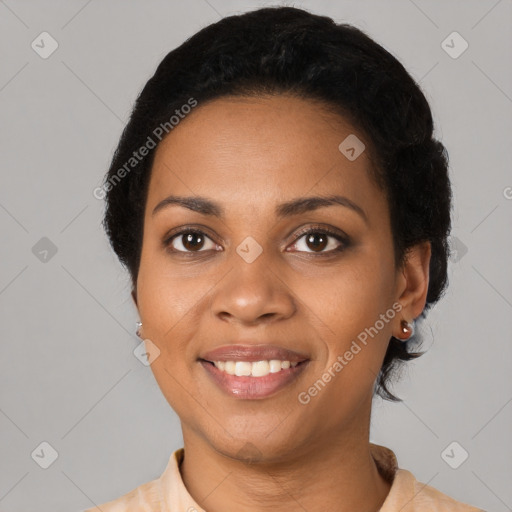 Joyful black young-adult female with short  black hair and brown eyes