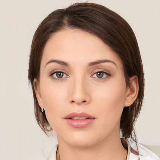 Neutral white young-adult female with medium  brown hair and brown eyes