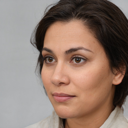 Neutral white young-adult female with medium  brown hair and brown eyes