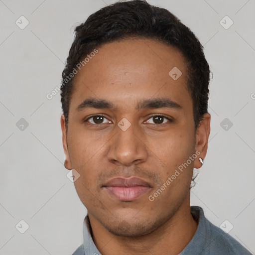 Neutral latino young-adult male with short  black hair and brown eyes