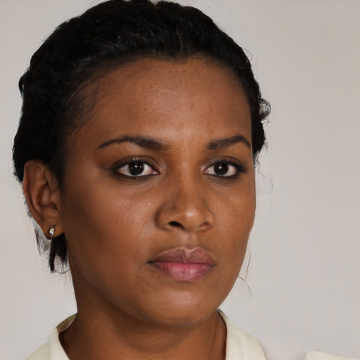 Neutral black young-adult female with short  black hair and brown eyes
