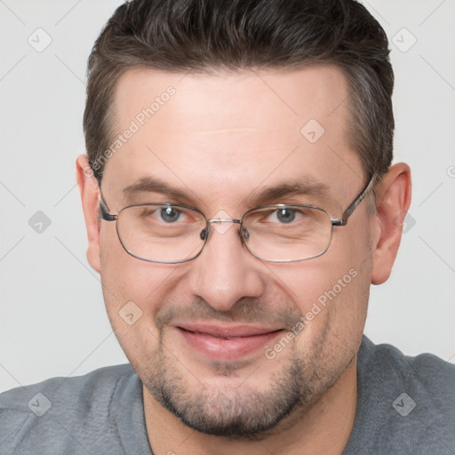 Joyful white adult male with short  brown hair and brown eyes