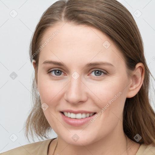 Joyful white young-adult female with medium  brown hair and blue eyes