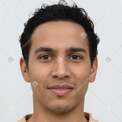 Joyful latino young-adult male with short  brown hair and brown eyes