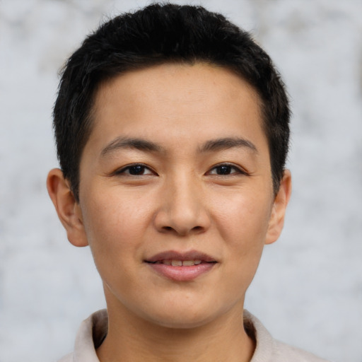 Joyful latino young-adult male with short  brown hair and brown eyes