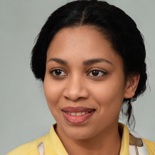Joyful latino young-adult female with medium  black hair and brown eyes