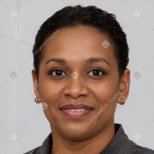 Joyful black adult female with short  brown hair and brown eyes