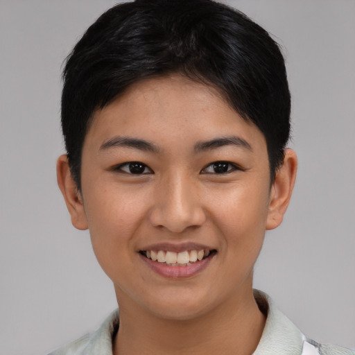 Joyful asian young-adult female with short  black hair and brown eyes