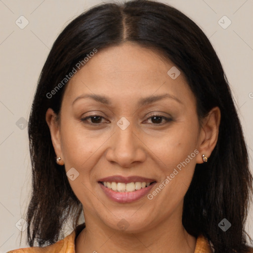 Joyful latino adult female with medium  brown hair and brown eyes