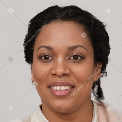 Joyful latino adult female with short  brown hair and brown eyes