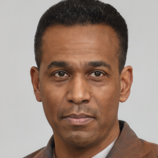 Neutral latino adult male with short  black hair and brown eyes