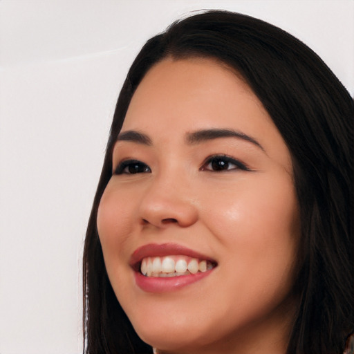 Joyful white young-adult female with long  black hair and brown eyes