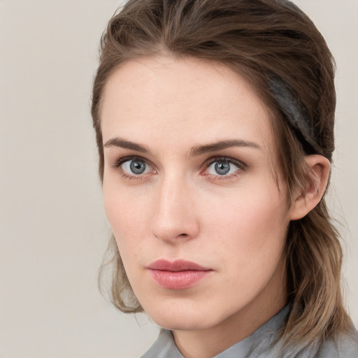 Neutral white young-adult female with medium  brown hair and grey eyes