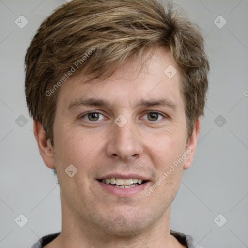 Joyful white adult male with short  brown hair and grey eyes