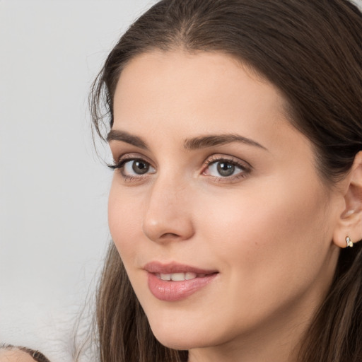 Neutral white young-adult female with long  brown hair and brown eyes