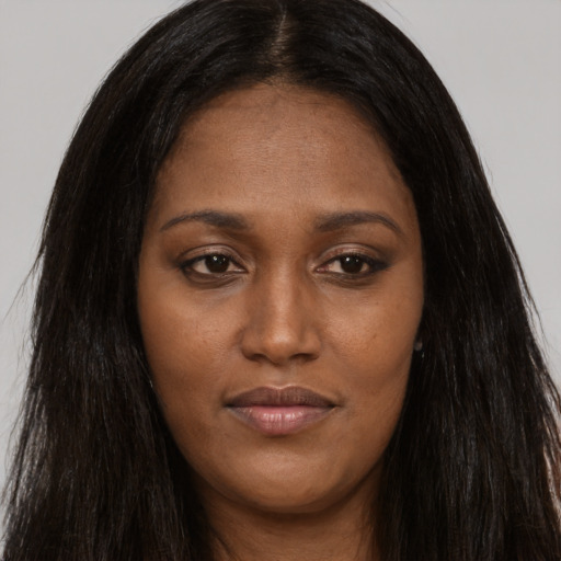 Joyful asian young-adult female with long  brown hair and brown eyes