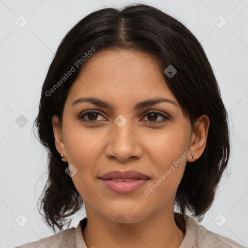 Joyful latino young-adult female with medium  brown hair and brown eyes