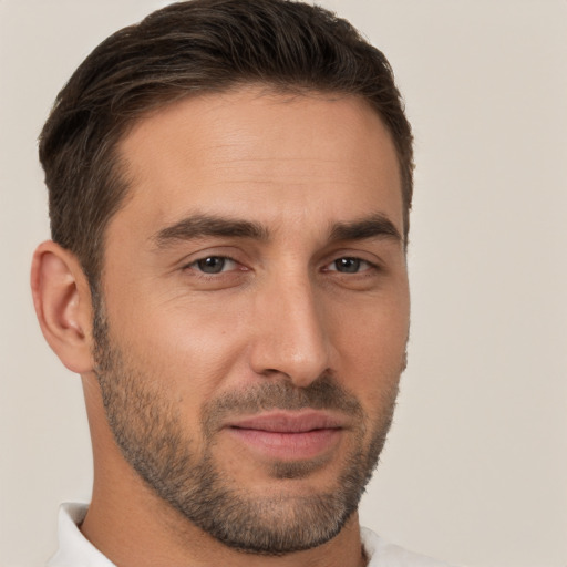 Joyful white young-adult male with short  brown hair and brown eyes