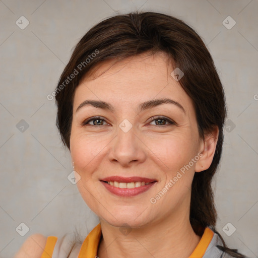 Joyful white adult female with medium  brown hair and brown eyes