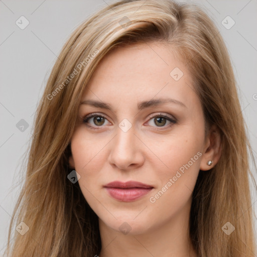 Joyful white young-adult female with long  brown hair and brown eyes