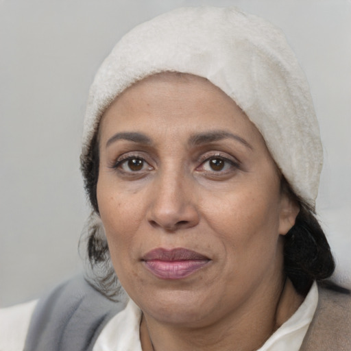 Joyful white adult female with short  black hair and brown eyes