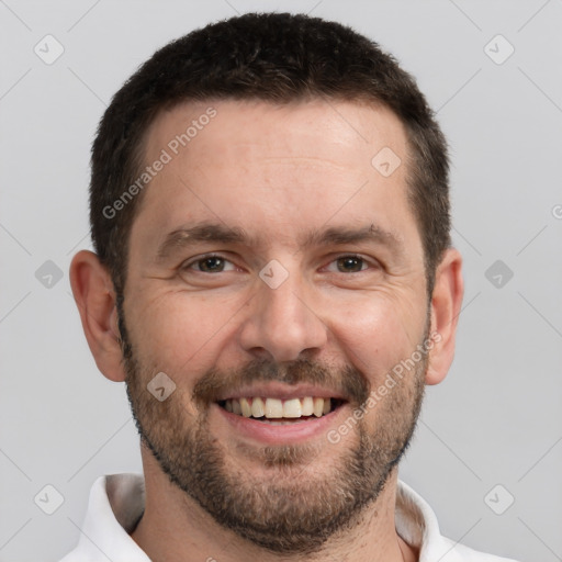 Joyful white adult male with short  brown hair and brown eyes