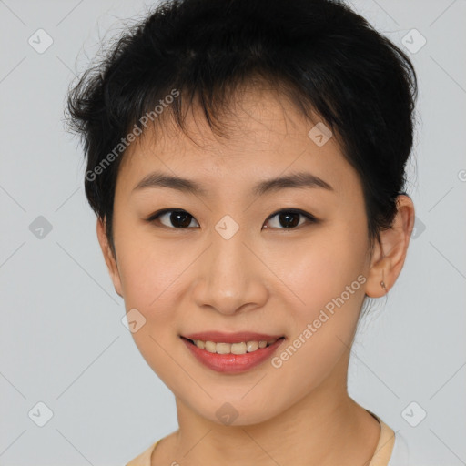 Joyful asian young-adult female with short  brown hair and brown eyes