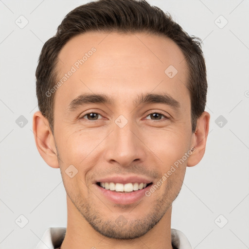 Joyful white young-adult male with short  brown hair and brown eyes