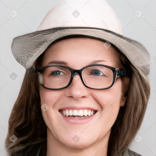 Joyful white young-adult female with medium  brown hair and blue eyes