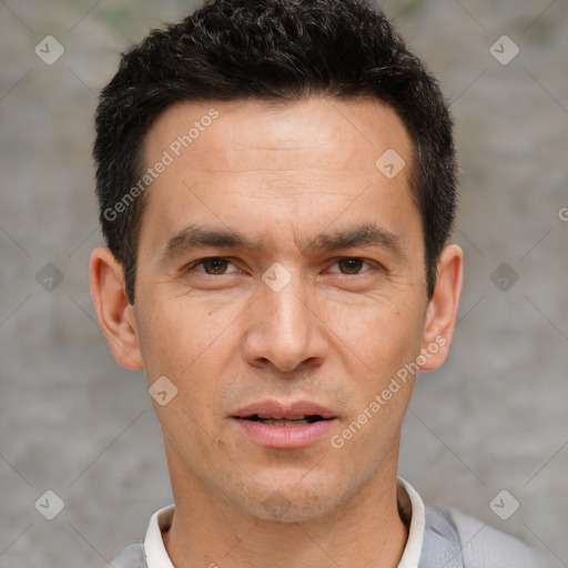 Joyful white adult male with short  brown hair and brown eyes