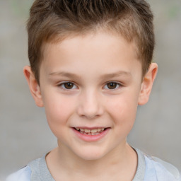 Joyful white child male with short  brown hair and brown eyes