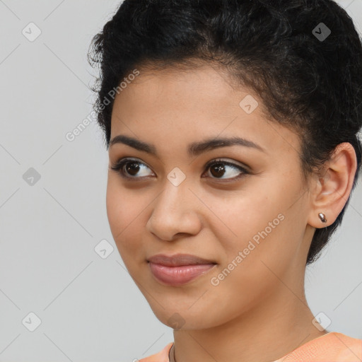 Joyful latino young-adult female with short  brown hair and brown eyes