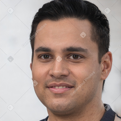 Joyful white young-adult male with short  black hair and brown eyes
