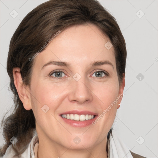 Joyful white young-adult female with medium  brown hair and grey eyes